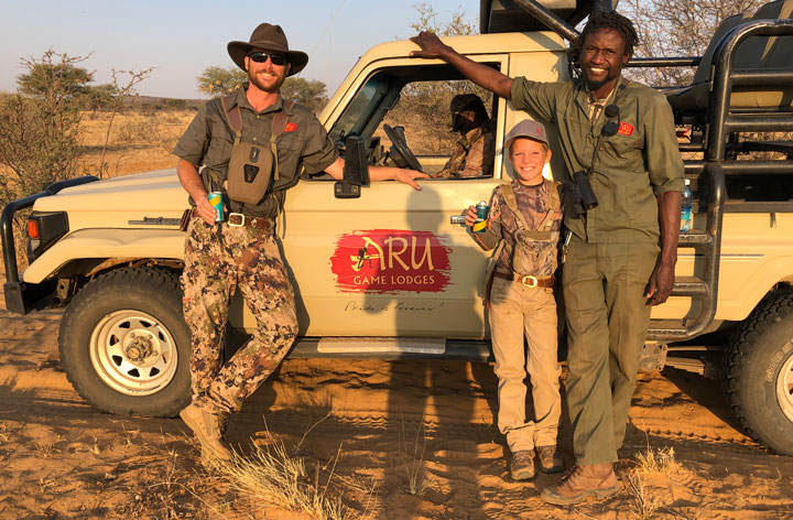 The author stands with his guides at the end of his safari