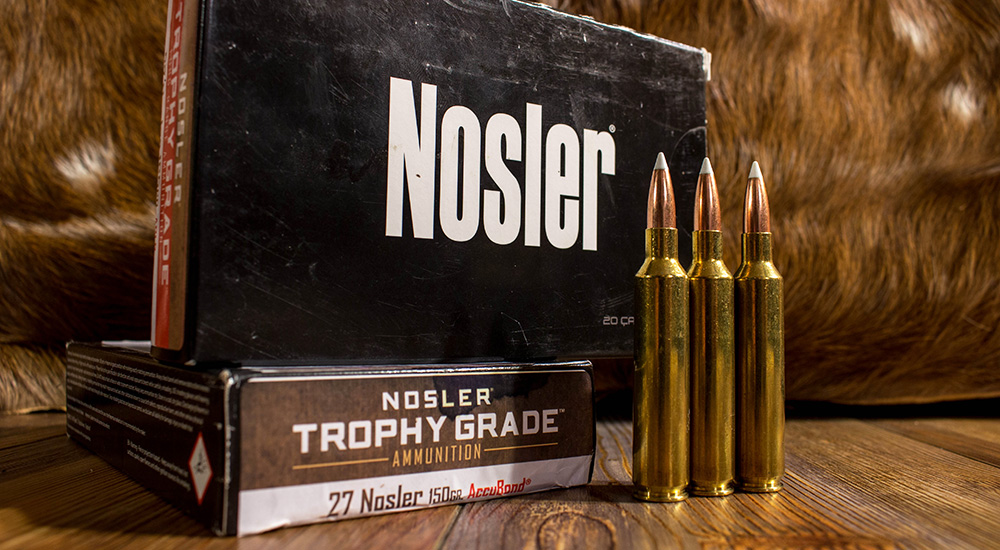 Nosler 27 Nosler 150 grain AccuBond ammunition on wood table.