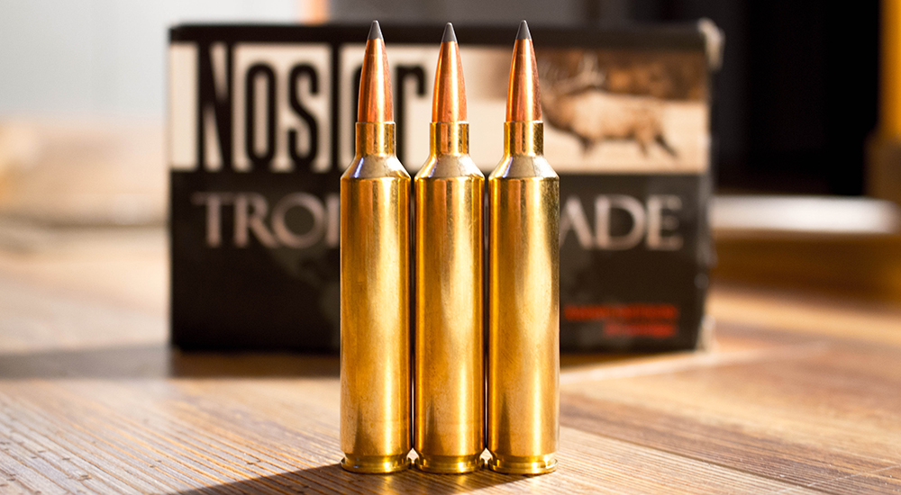 Three rounds of 26 Nosler Trophy Grade ammunition.