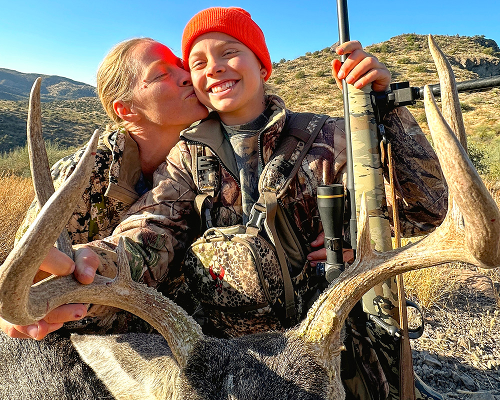 Mother and daughter hunters posing with Coues deer.