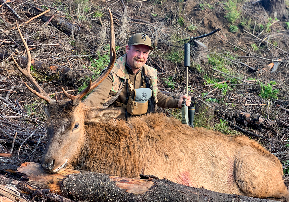 Male hunter posing with Roosevelt bull elk.