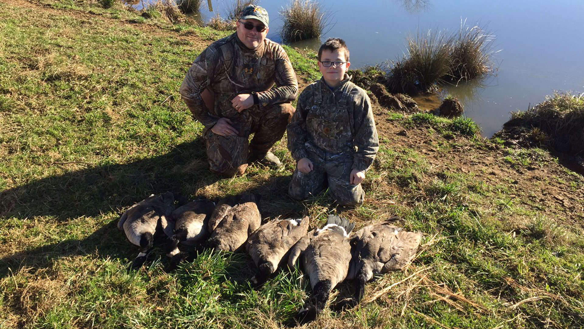 Hunters with geese