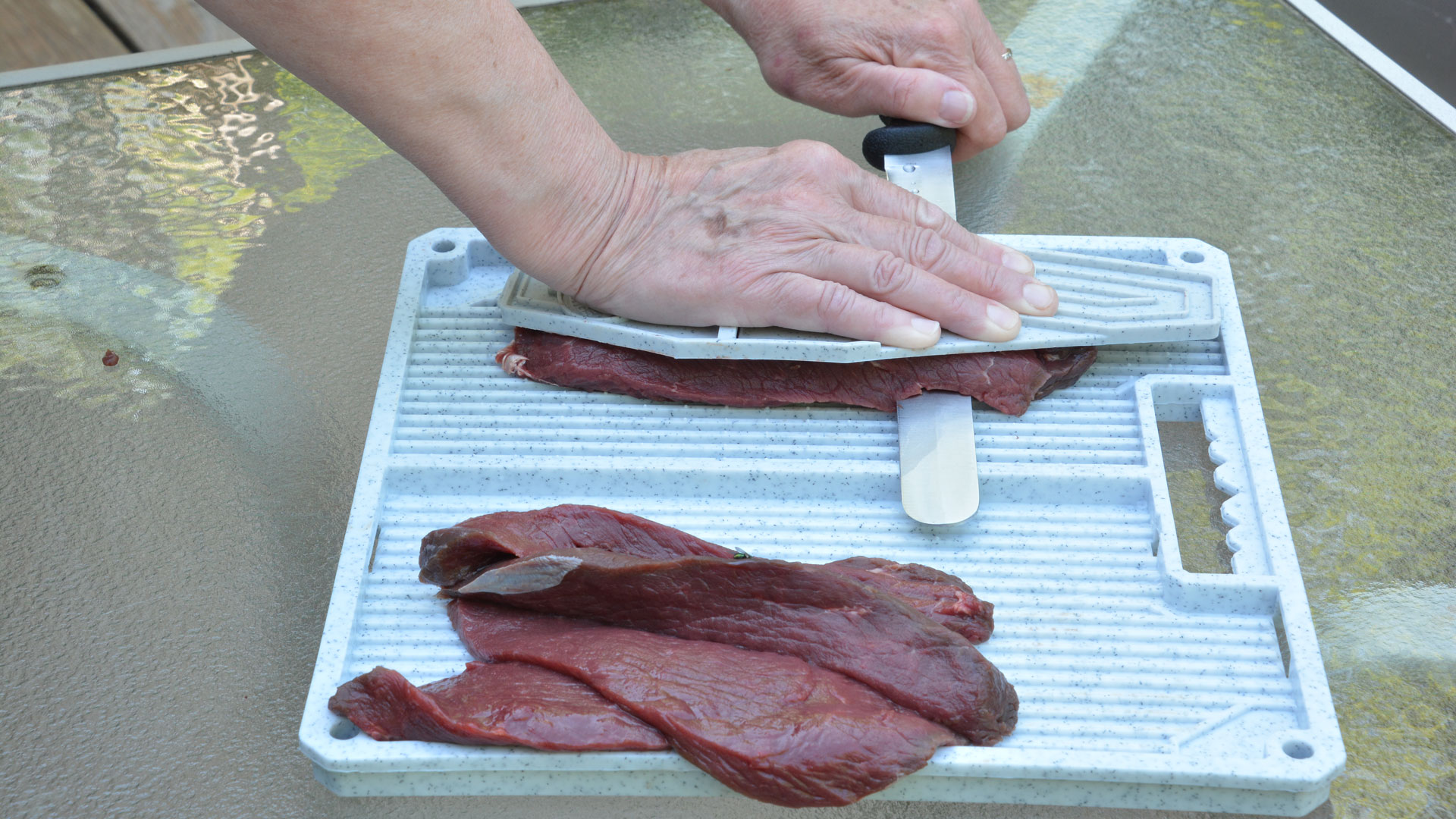 Cutting jerky on a board