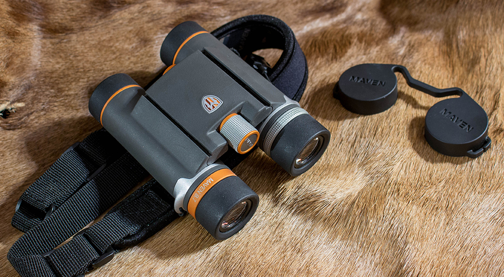 Maven B.7 8x25 Binocular with lens covers on deer hide.