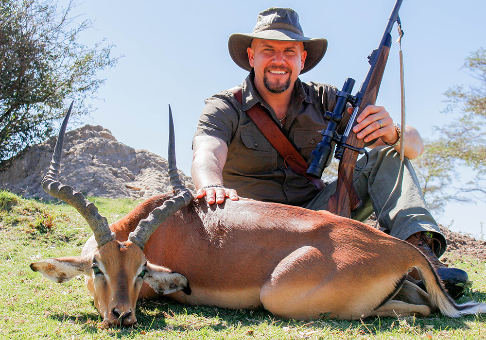 Man posing with Impala.