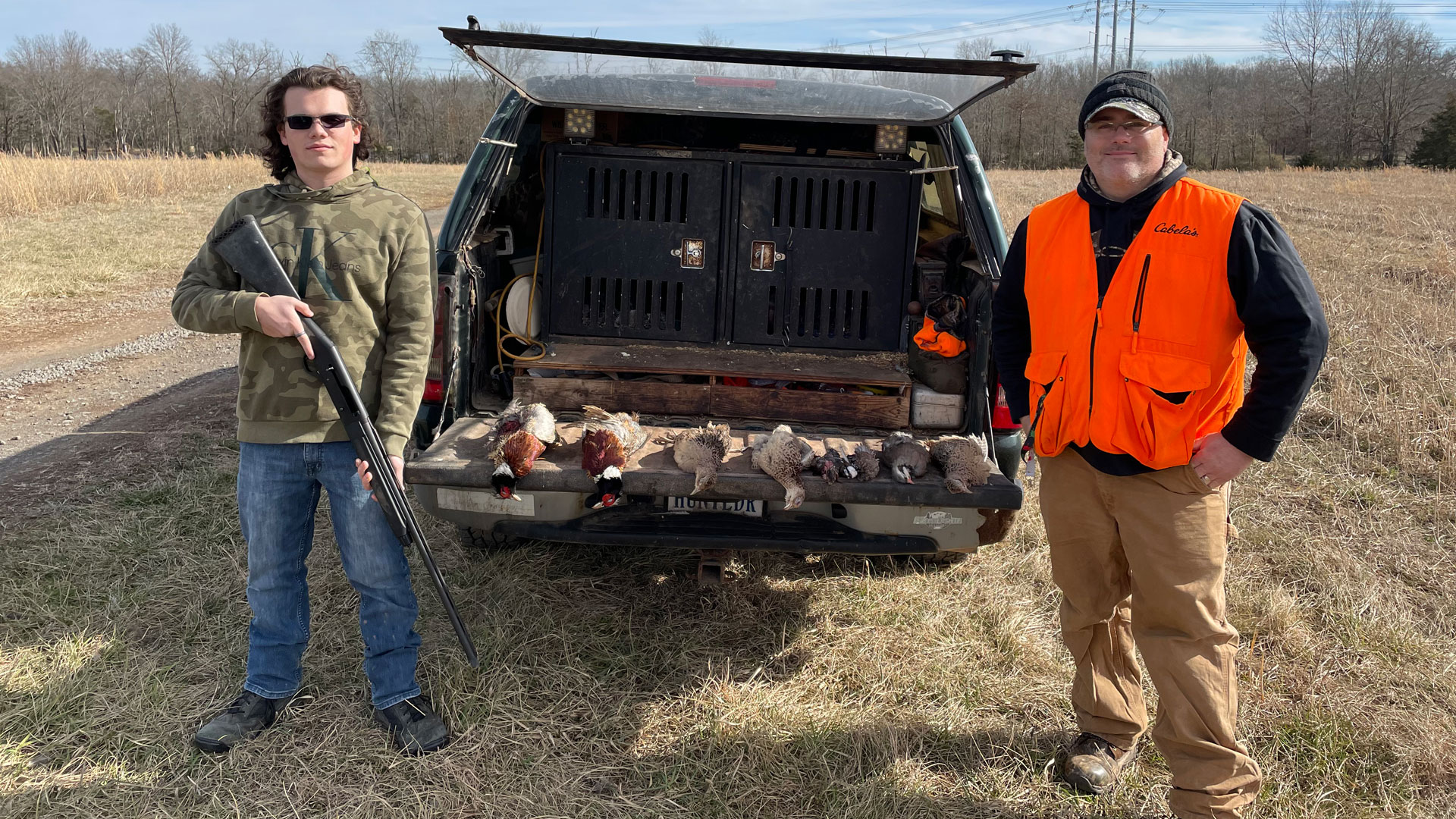 Hunters with pheasants