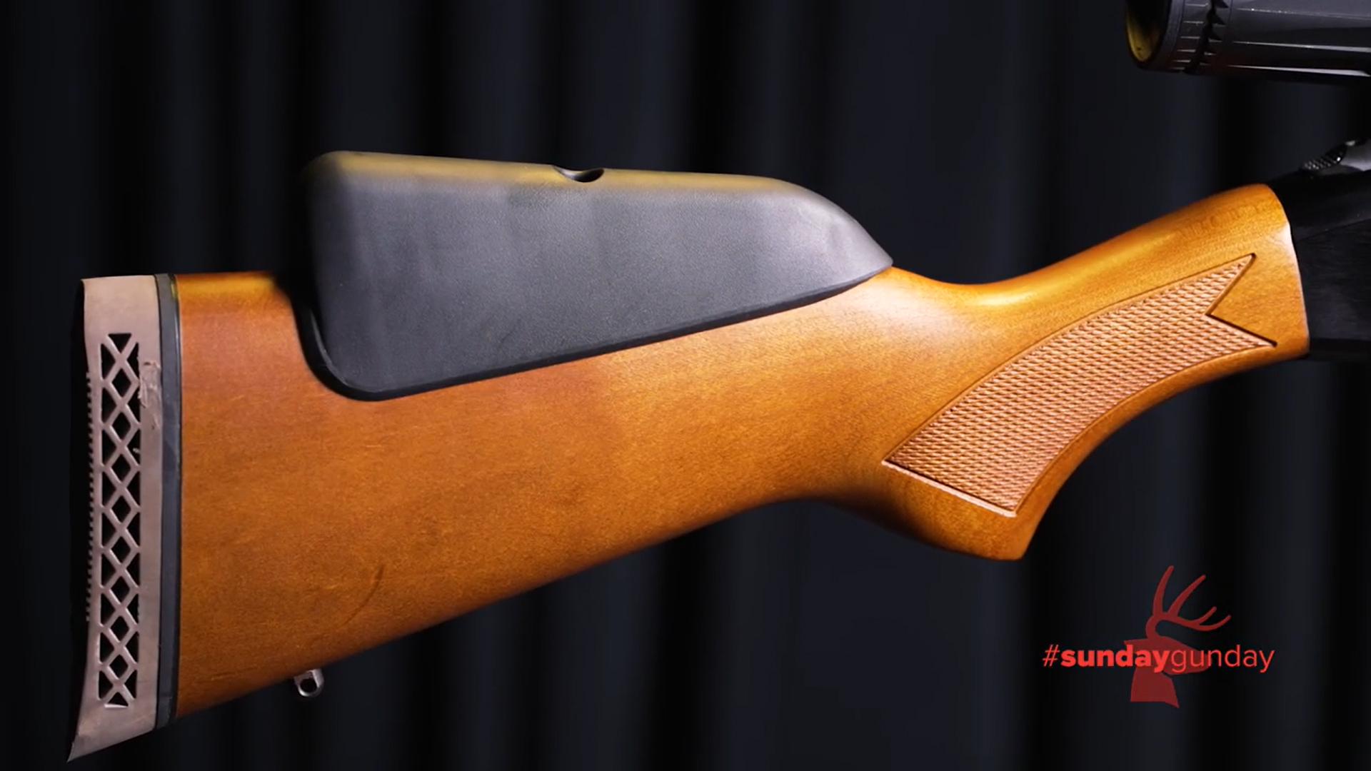 Mossberg Model 500 combo wood stock shown with cheek riser attached and rubber recoil pad