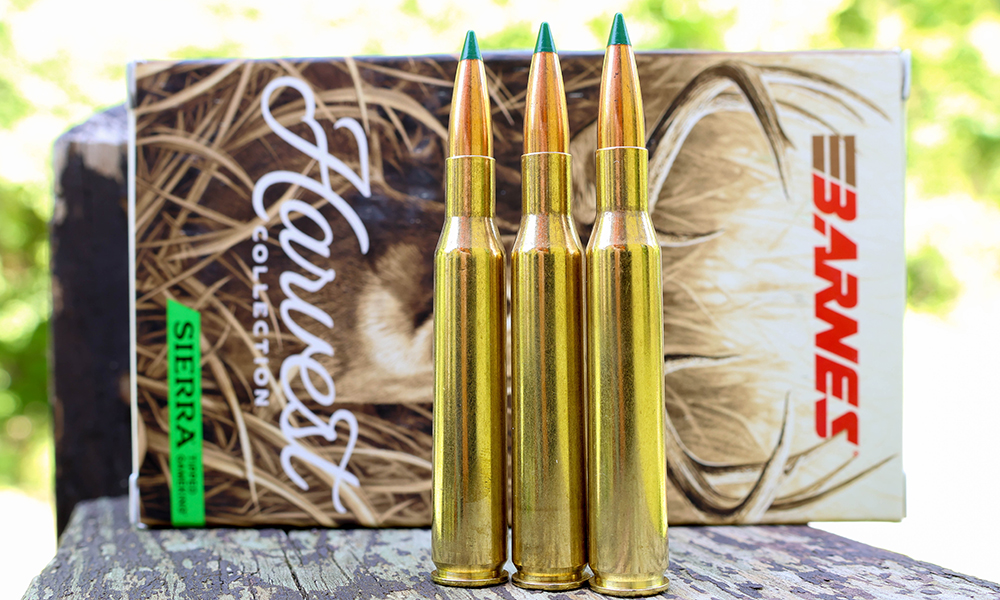 Barnes Harvest Collection Sierra ammunition box with three rounds on wood table.