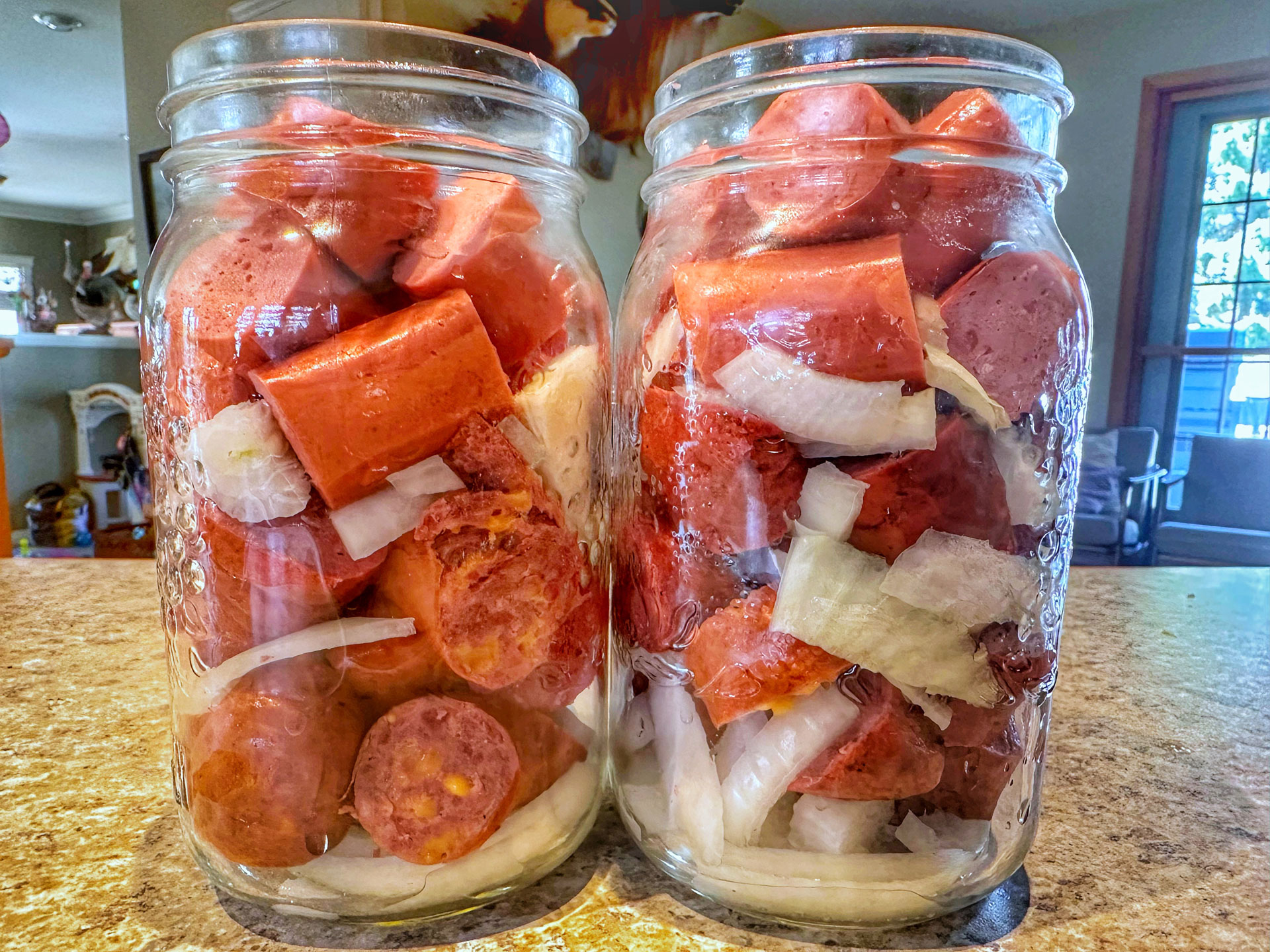 Pickled, smoked sausage in jars