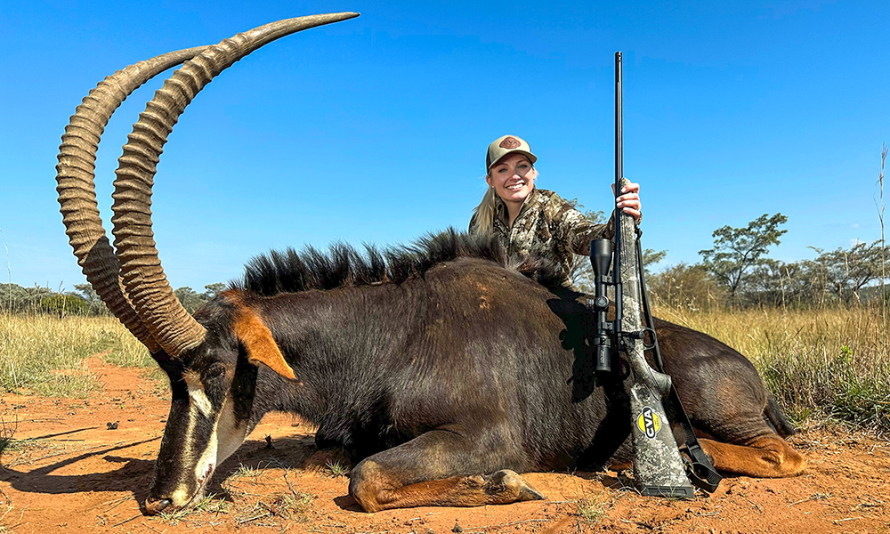 Female hunter posing with sable in South Africa.