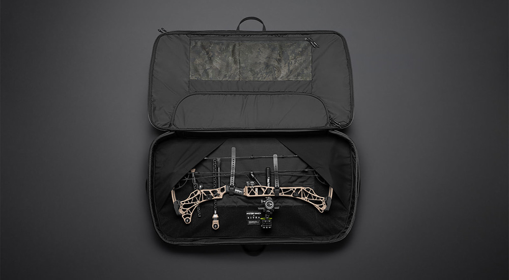 Mystery Ranch x Sitka Ryder Bow Case opened with bow inside.